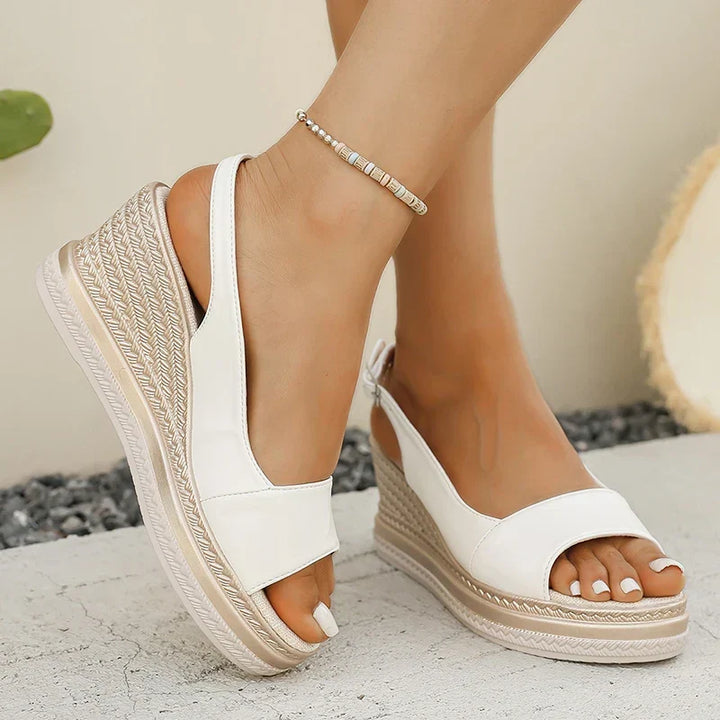 LIVIANA WEDGE SANDALS" could be rephrased as "LIVIANA ELEVATED WEDGE SANDALS.